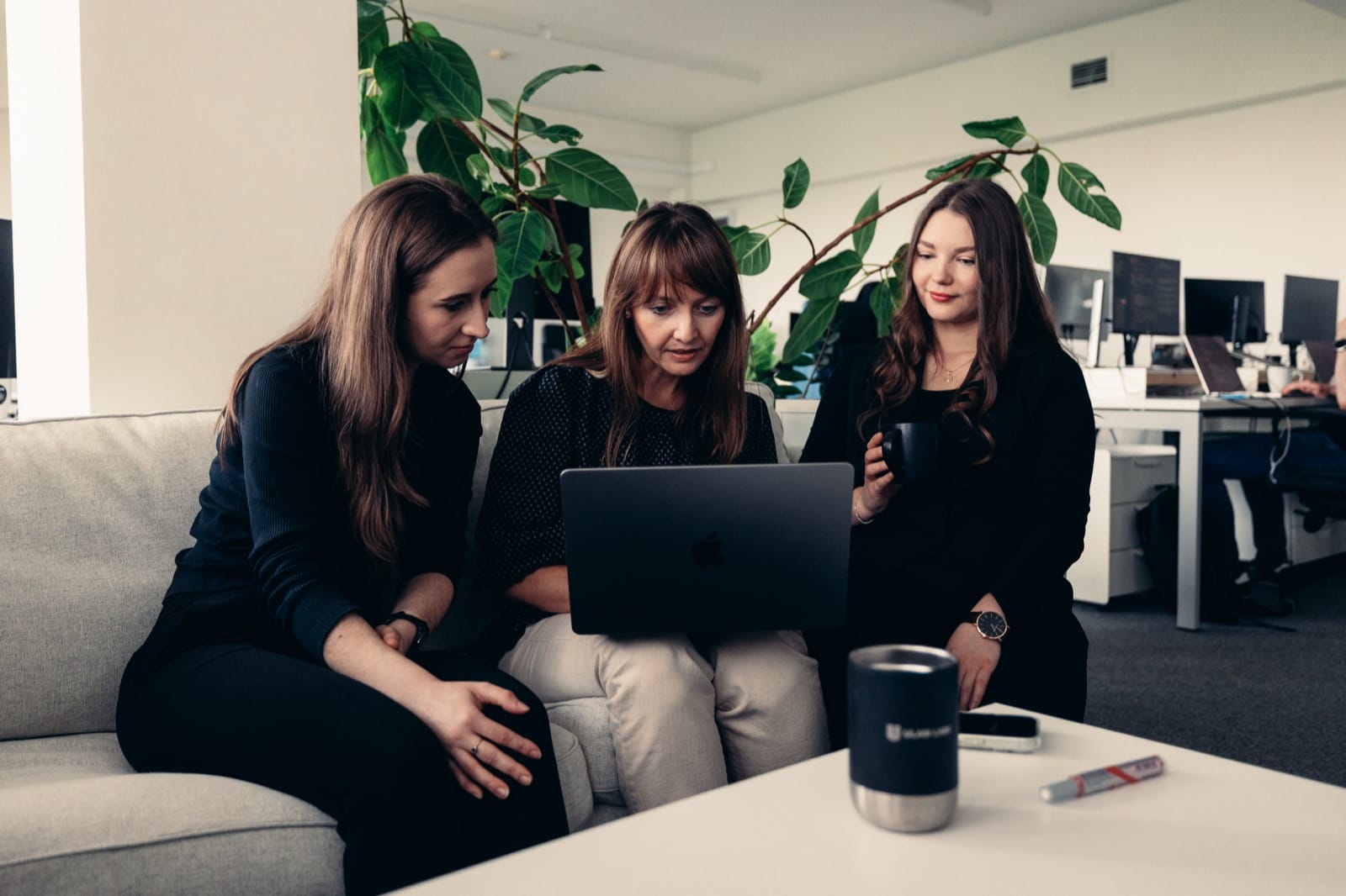 ULAM LABS team collaborating on MedTech software in the office