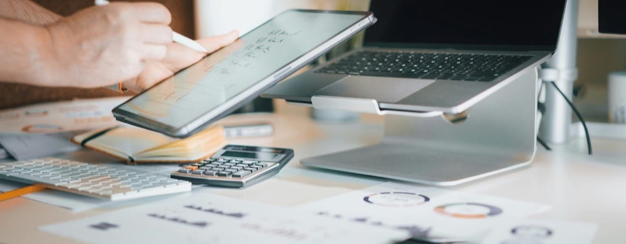 Laptop and documents used for health economics analysis